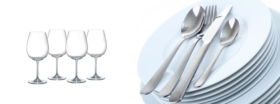 Wine glasses and a stack of clean plates